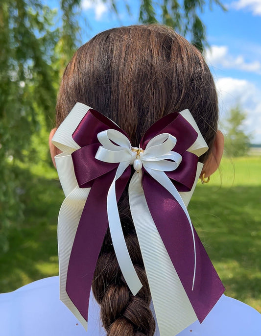 Burgundy horse show bow with pearl details for jumper riders