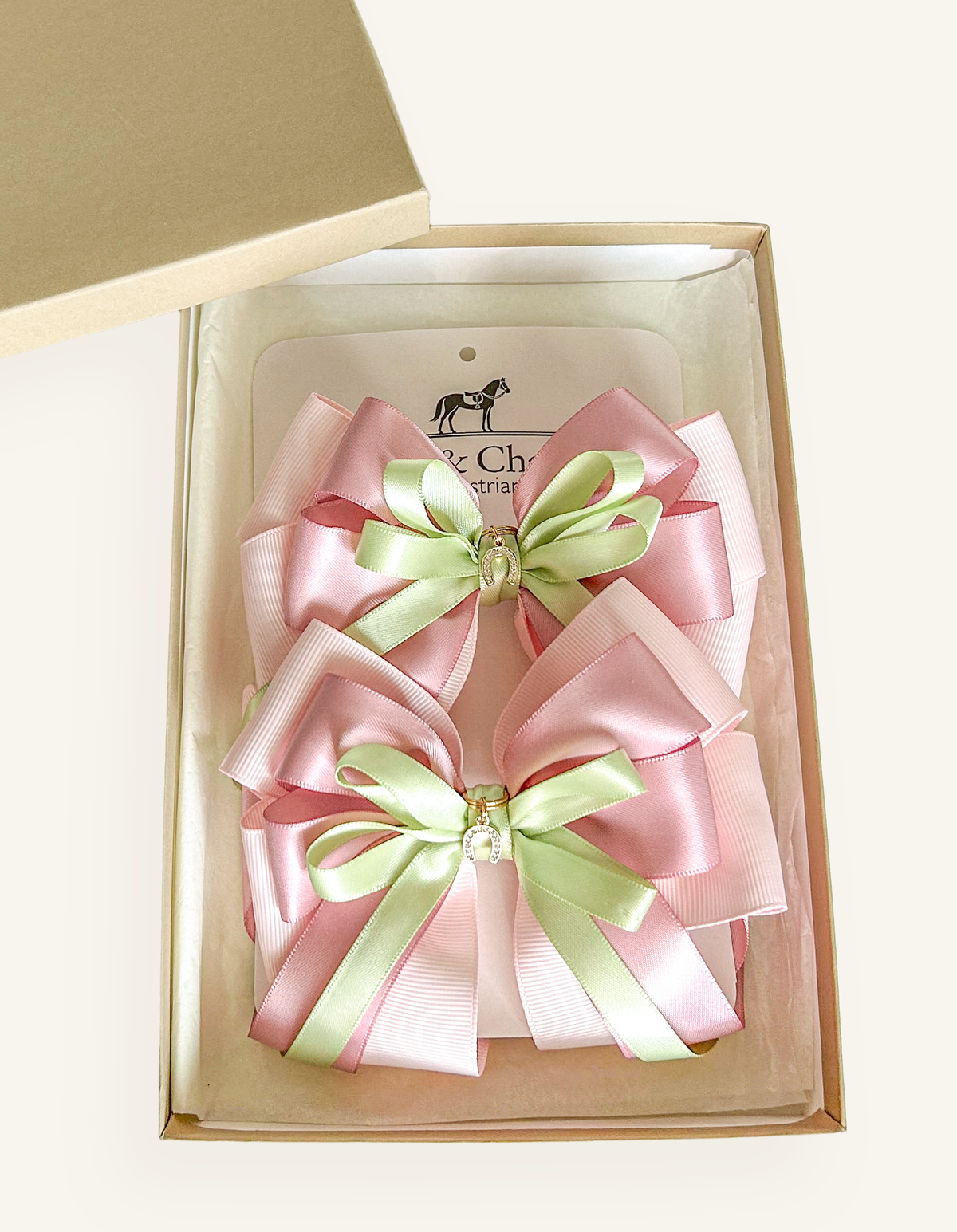 Handcrafted pink equestrian bows for horse shows