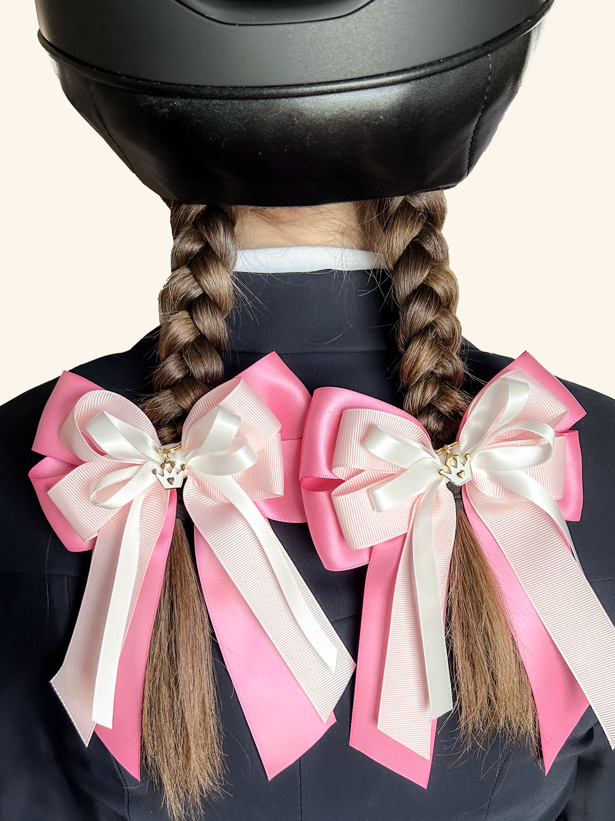 Young equestrian wearing pink and white horse show bows with braids – Pretty in Pink by Bows & Charms