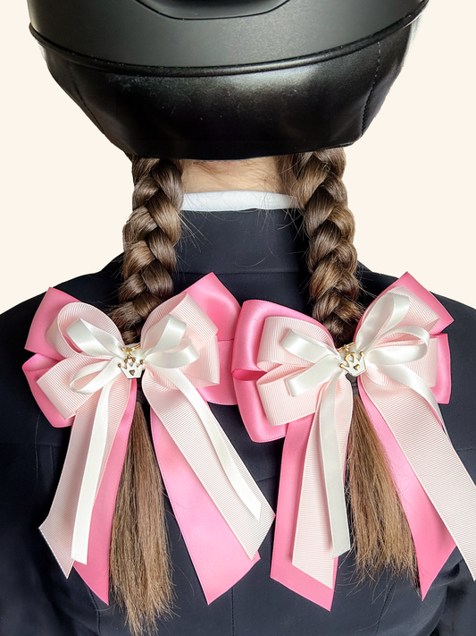 Young equestrian wearing pink and white horse show bows with braids – Pretty in Pink by Bows & Charms