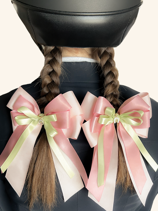 Pink horse show bows for young equestrian riders