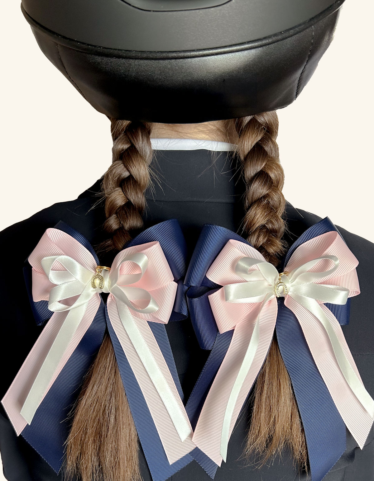 Royal Blush navy and pink equestrian hair bows worn on braided hair